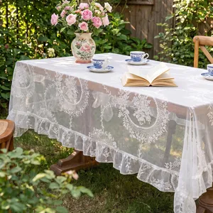 French pastoral lace tablecloth with delicate hollow floral pattern and elegant ruffle edge.