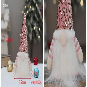 Nahaufnahme des rosa Pailletten-Weihnachtswichtels, die Hutstruktur und weichen Bart zeigt.