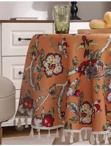 Vintage botanical floral tablecloth with lovely tassels, warm orange fabric for home decor.