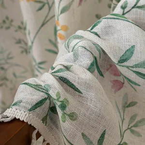 Pastoral style linen curtain with fresh floral and leaf print and delicate fringe edges.