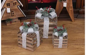 Detailed view of Christmas iron gift box set with silver glitter bows and pinecones.