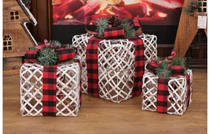 Christmas iron gift boxes detail display featuring classic red and black plaid ribbon decor.