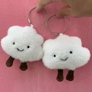 Detailed view of fluffy white cloud plush keychain featuring cute brown legs and steel ring.