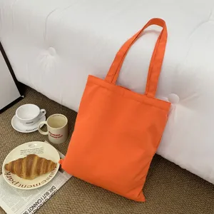 Oranger Segeltuch Shopper mit doppelten Henkeln, ästhetische Freizeittasche für den Alltag.