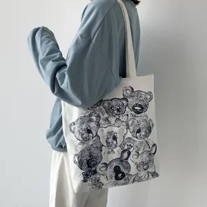 Close-up detail of retro sketch bear canvas tote bag, showing unique art print and fabric.