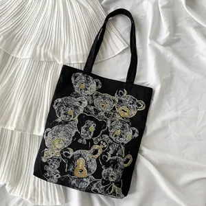 Black canvas tote bag with retro bear print, casual shoulder bag for daily use.
