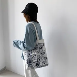 Canvas tote bag with cute bear sketch print, casual shoulder bag for daily student travel.