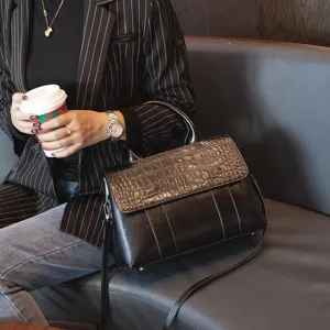 Genuine leather top handle shoulder bag with vintage crocodile pattern flap design for women.