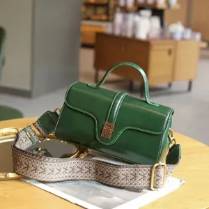 Green genuine leather retro crossbody bag, stylish top handle shoulder bag for women detail view.