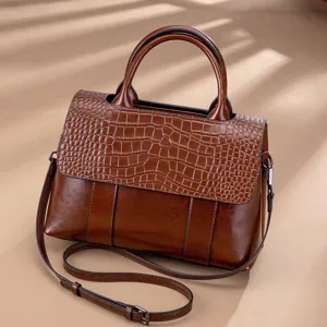 Vintage genuine leather women handbag, retro brown crossbody shoulder bag for daily use.