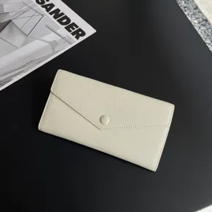 Minimalist leather long wallet for women, soft cowhide envelope purse with snap button chic.