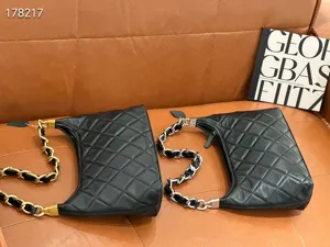 Black quilted leather shoulder bag with chain strap, vintage commuter handbag for women.