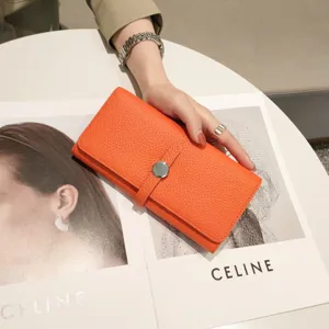 Premium orange leather long wallet for women, classic flap design with metal closure for daily use.