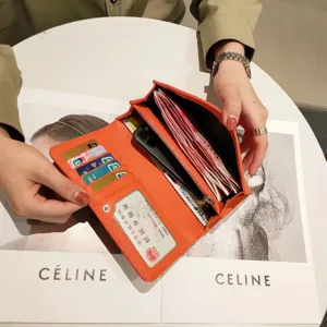 Orange genuine leather long wallet with multi-card slots and zipper pocket for women.