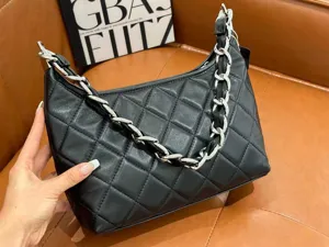 Black quilted leather shoulder bag with metal chain strap, vintage casual commuter underarm handbag.