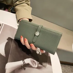 Genuine leather long wallet for women in sage green with elegant strap and metal clasp detail.