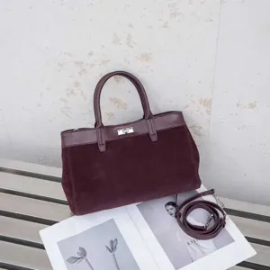 Burgundy suede leather top handle tote bag with turn lock closure and shoulder strap