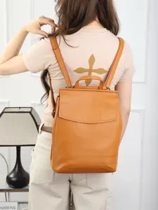 Natural tumbled top layer cowhide solid color leather backpack casual campus schoolbag.