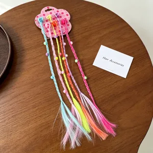 Colorful kids hair extensions braids clips detail view showing vibrant hair ropes beads.
