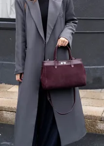 Elegant burgundy suede tote bag for women, stylish contrast leather design with shoulder strap.