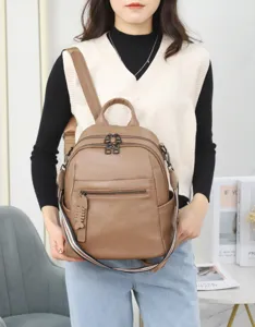 Detailed view of women's casual leather backpack, stylish daily school bag for modern girls.