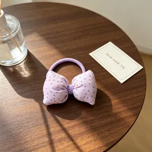 Chouchou nœud violet à pois pour filles, accessoire de coiffure élastique et charmant.