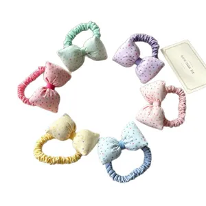 Chouchous nœud pois en tissu pour enfants, attaches queue de cheval élastiques et colorées.