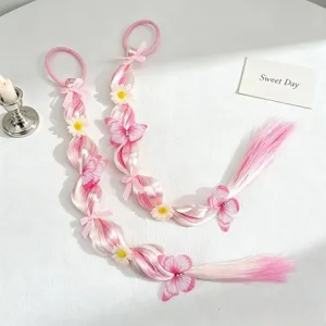 Detailed view of sweet pink gradient synthetic hair braid with cute flowers and butterflies.
