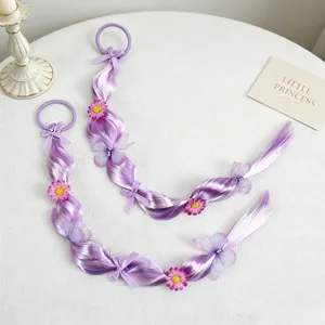 Detail view of purple braided hair extensions with cute flowers and bows for girls.