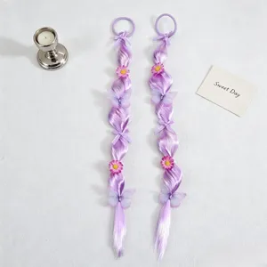 Close-up detail of purple hair extension ponytail with cute butterfly and flower decor.