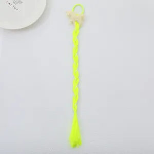 Neon yellow synthetic braided hair extension detail with sparkly unicorn and cute hair tie.