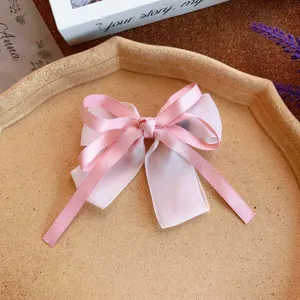 Sweet pink bow hair clip with ribbons, cute hair accessory for girls and women daily wear.
