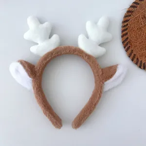 Joli serre-tête en peluche avec bois de renne marron et blanc, idéal pour Noël et look mignon.