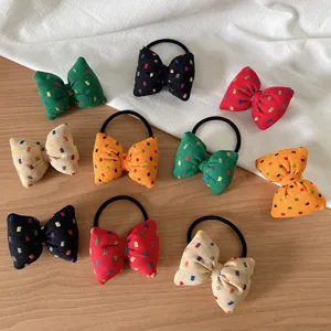 Korean style bow hair scrunchies with colorful block print, elastic hair ties detail view.