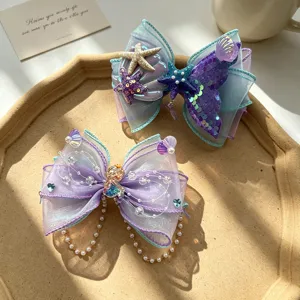 Kids mermaid bow hair clip set with shell starfish pearls and chains for cute girls.