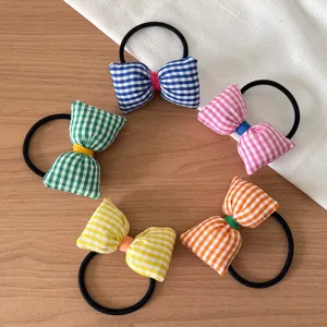 Joli ensemble d'élastiques à cheveux en tissu à nœud papillon écossais pour filles et femmes.