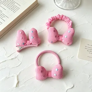 Rosa gepunktetes 3D Schleifen Haarspangen und Haargummi Set für süße kleine Mädchen.