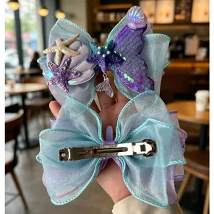 Mermaid bow hair clip for girls, blue organza starfish seashell hair barrette, cute kids accessory.
