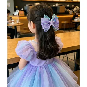 Kids mermaid bow hair clip detail, purple gradient organza hair accessory with starfish.