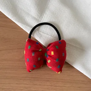Korean style red bow hair tie scrunchie with colorful dot pattern for daily cute hairstyles.