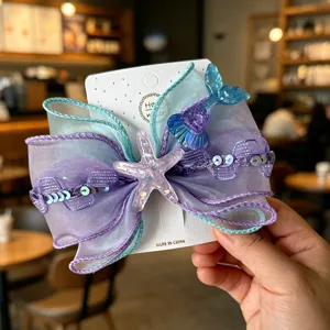 Kids mermaid hair bow clip with organza ribbon, starfish and tail design for girls hair styling.