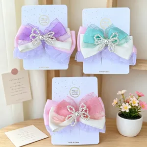 Pinzas de pelo de lazo dulce lindo para mujeres, accesorios de pelo de perla de malla elegante.