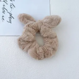 Plush rabbit ear hair scrunchie detail shot, cute fuzzy pony tail holder for autumn and winter.