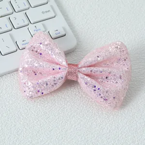 Pince à cheveux nœud à paillettes roses détail, accessoire cheveux scintillant pour filles.