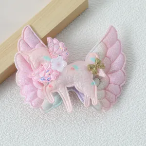 Cute angel wings unicorn hair clip for kids, sparkling sequin side hair accessory detail.