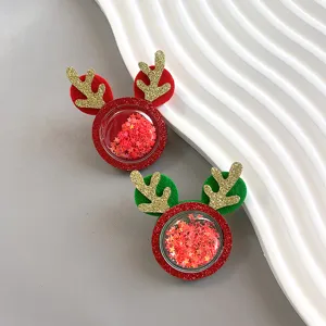 Christmas glitter reindeer antler hair clips detail view, cute festive cartoon kids hair accessories.