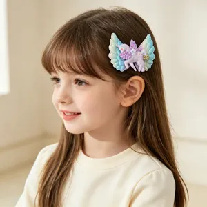 Cute unicorn wing hair clip for girls, sparkly side clip detail showcasing lovely kids accessory.