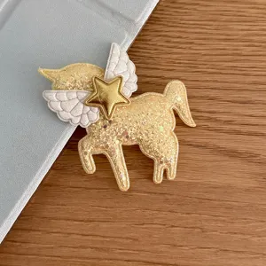 Glitter unicorn pony patch with angel wings and gold star for DIY hair accessories and bags.