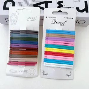 Close-up of colorful bobby pins set in various autumn shades, minimalist metallic hair clips.
