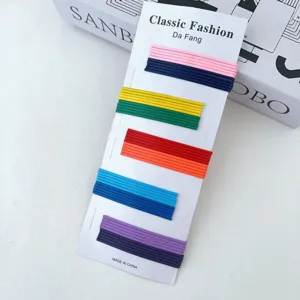 Detailed view of colorful bobby pins set, simple sweet hair clips on display card for daily styling.